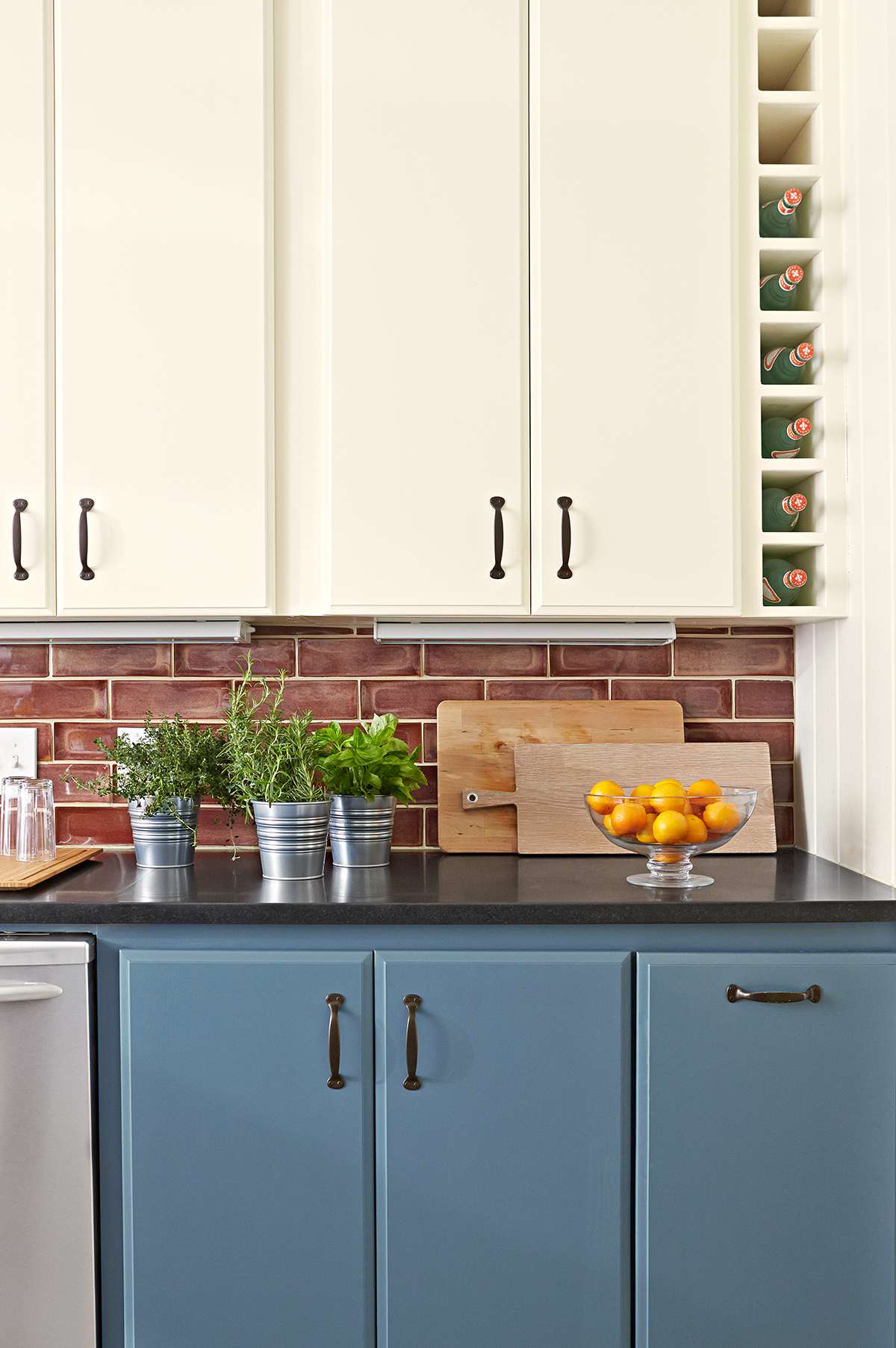 two-tone blue and white kitchen cabinets with lighting strips
