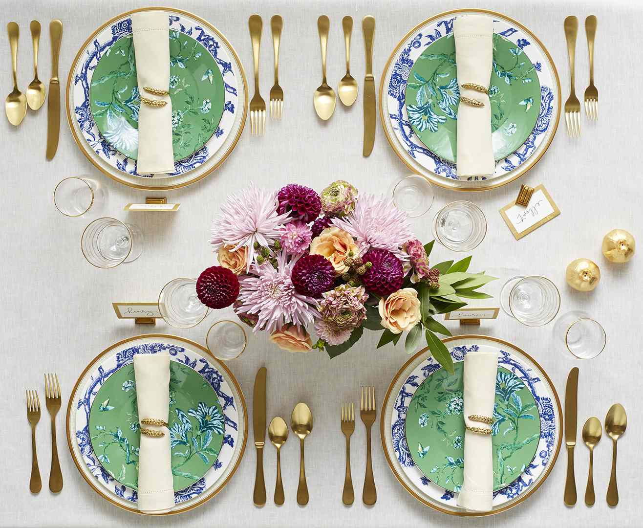 formal table setting with green, blue and gold