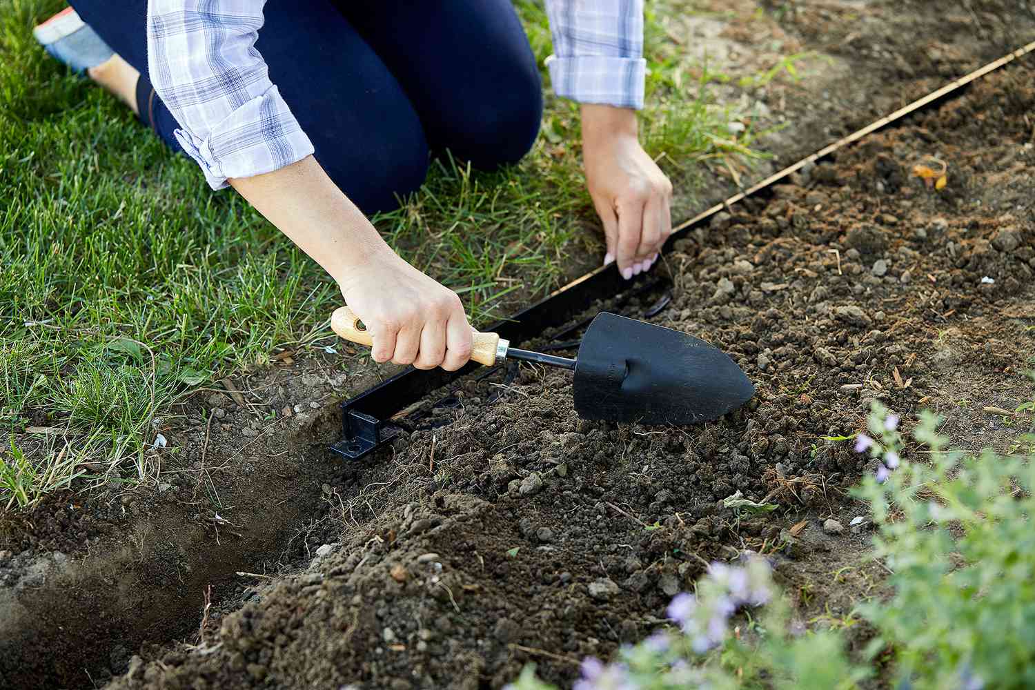 shovel soil around high-quality edging