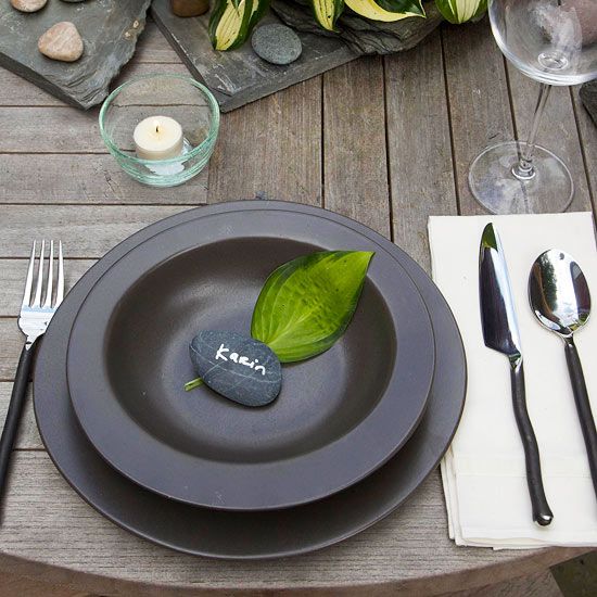 Black plate and bowl with leaf