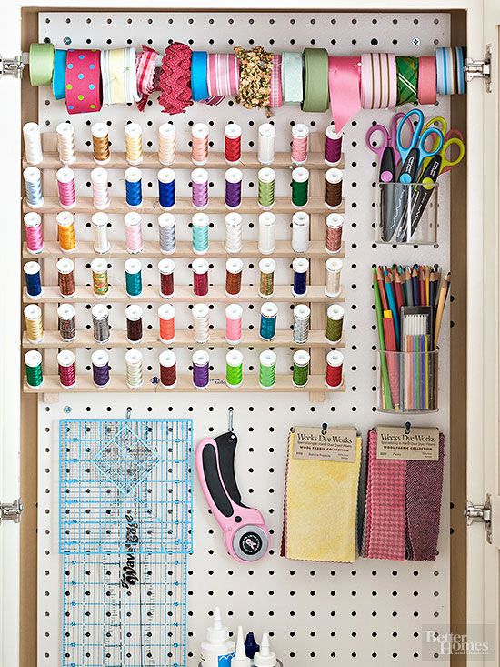peg board covered in thread and ribbon