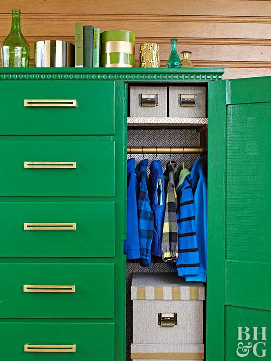 green armoire with gold handles