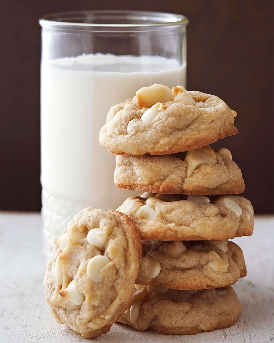 Macadamia Nut and White Chocolate Chip Cookies with a glass of milk