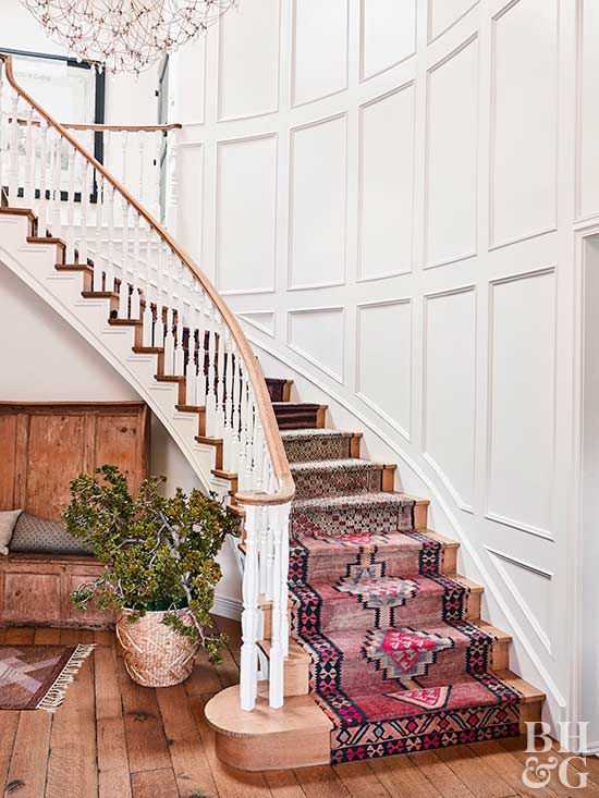 curved staircase with turkish kilim rugs