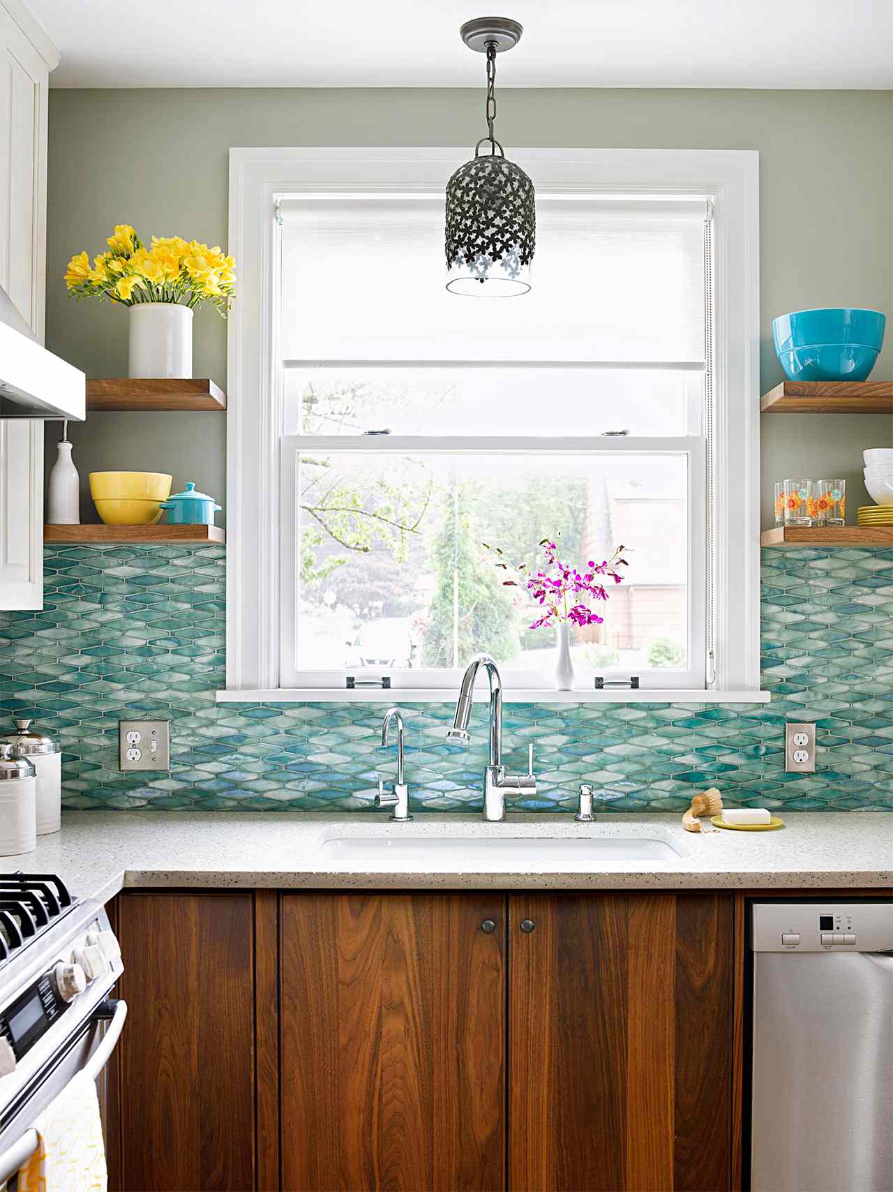 kitchen window above backsplash and walnut cabinets