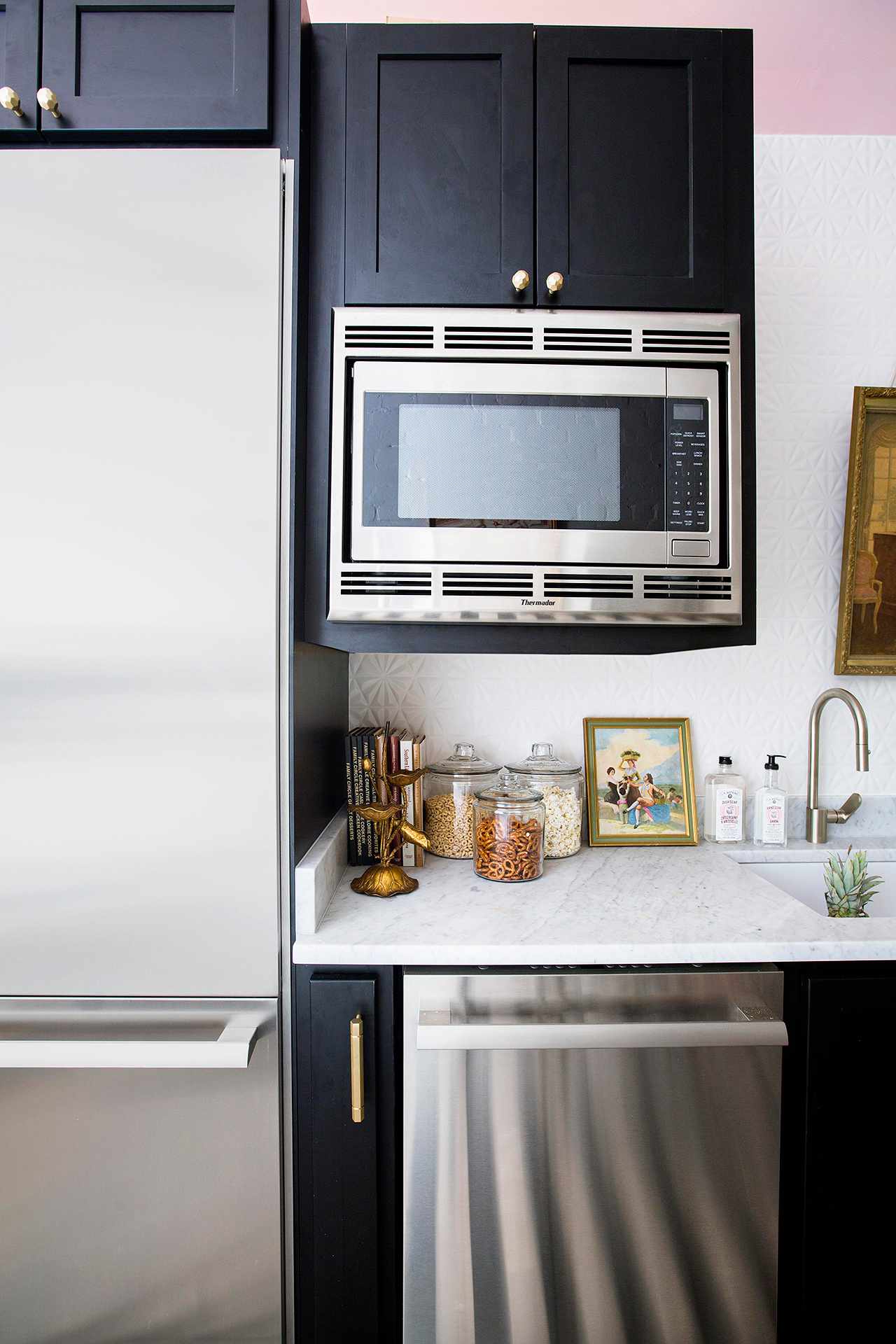 black kitchen cabinets with stainless appliances