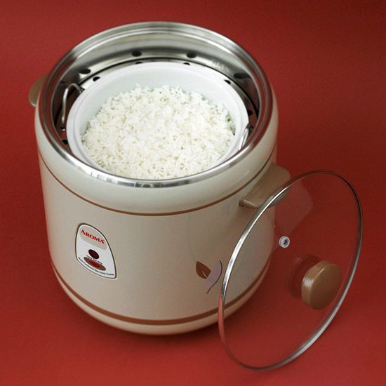 Rice steamer with rice in cooker