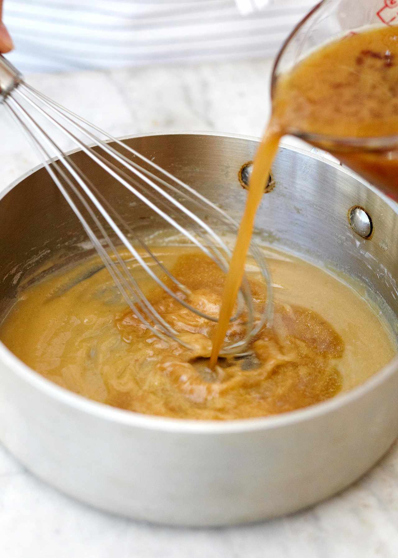 add drippings to chicken gravy with whisk