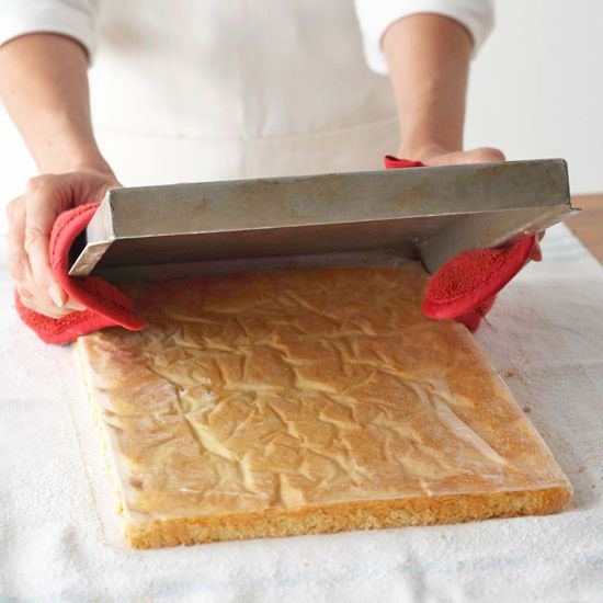 Cake being inverted from jelly roll pan