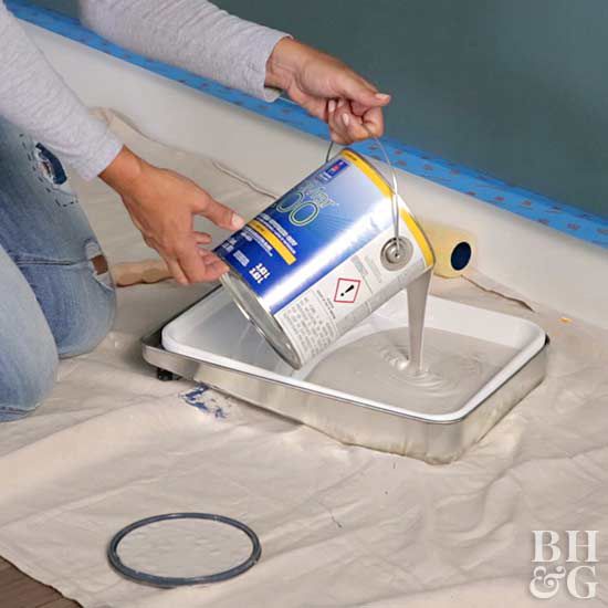 pouring neutral paint into tray