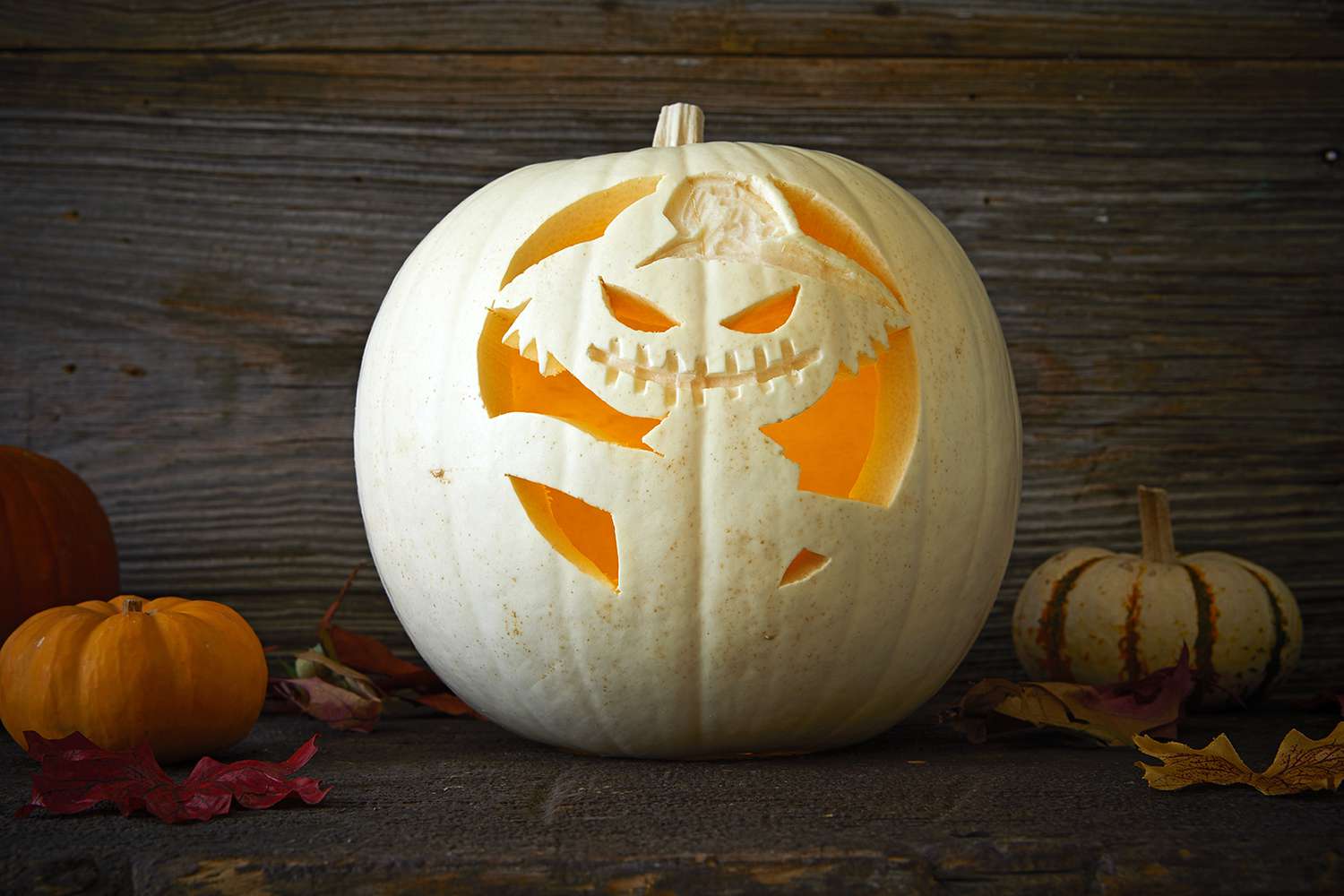 gremlin with hat carved into pumpkin