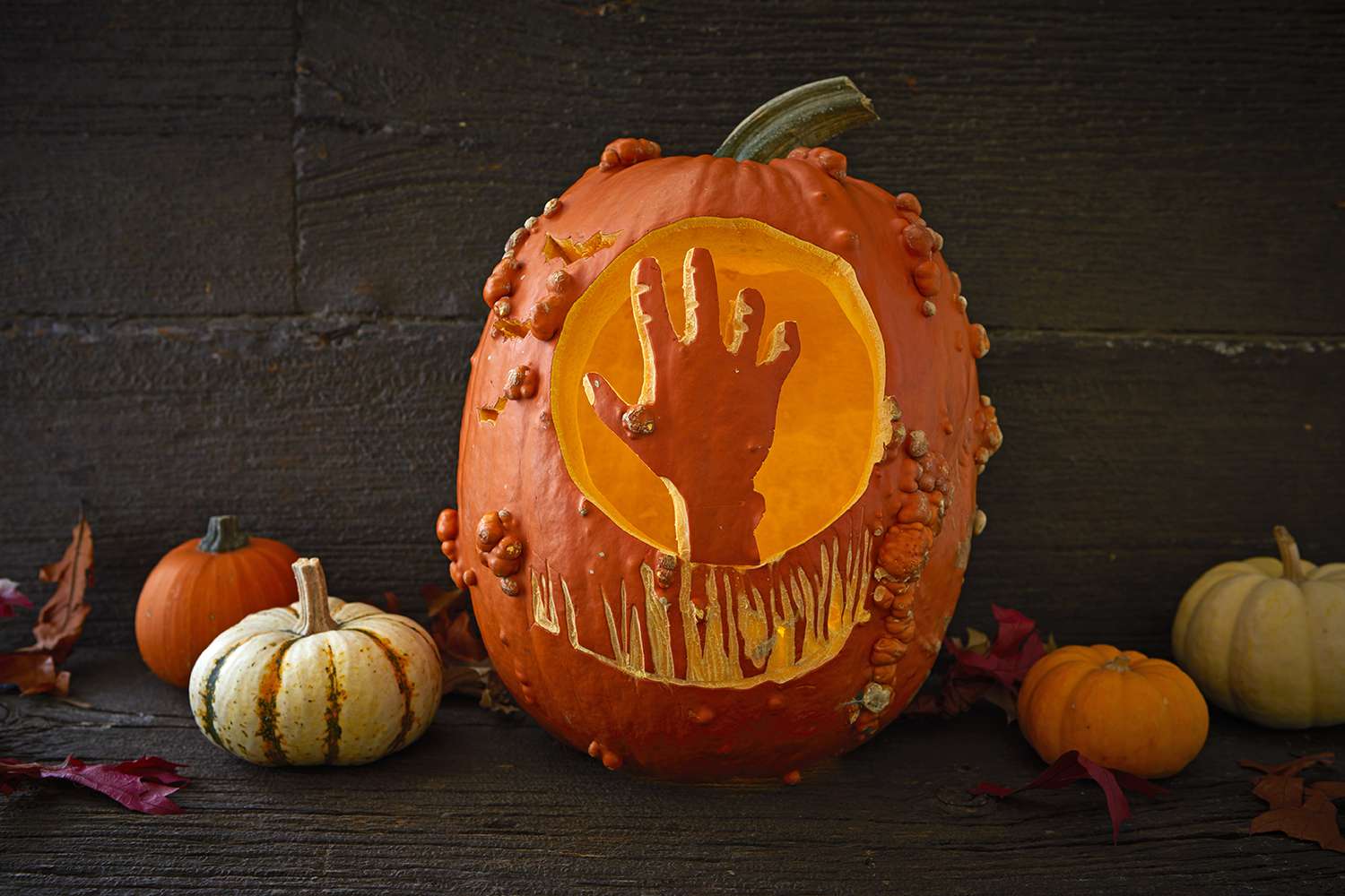 hand from grave carved into pumpkin