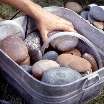 Placing Layer of Rocks Over Clay Pots