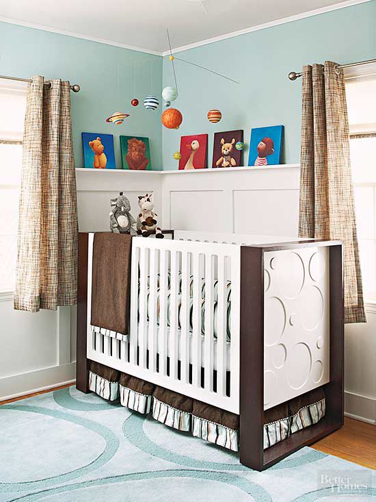 baby crib in blue and white room