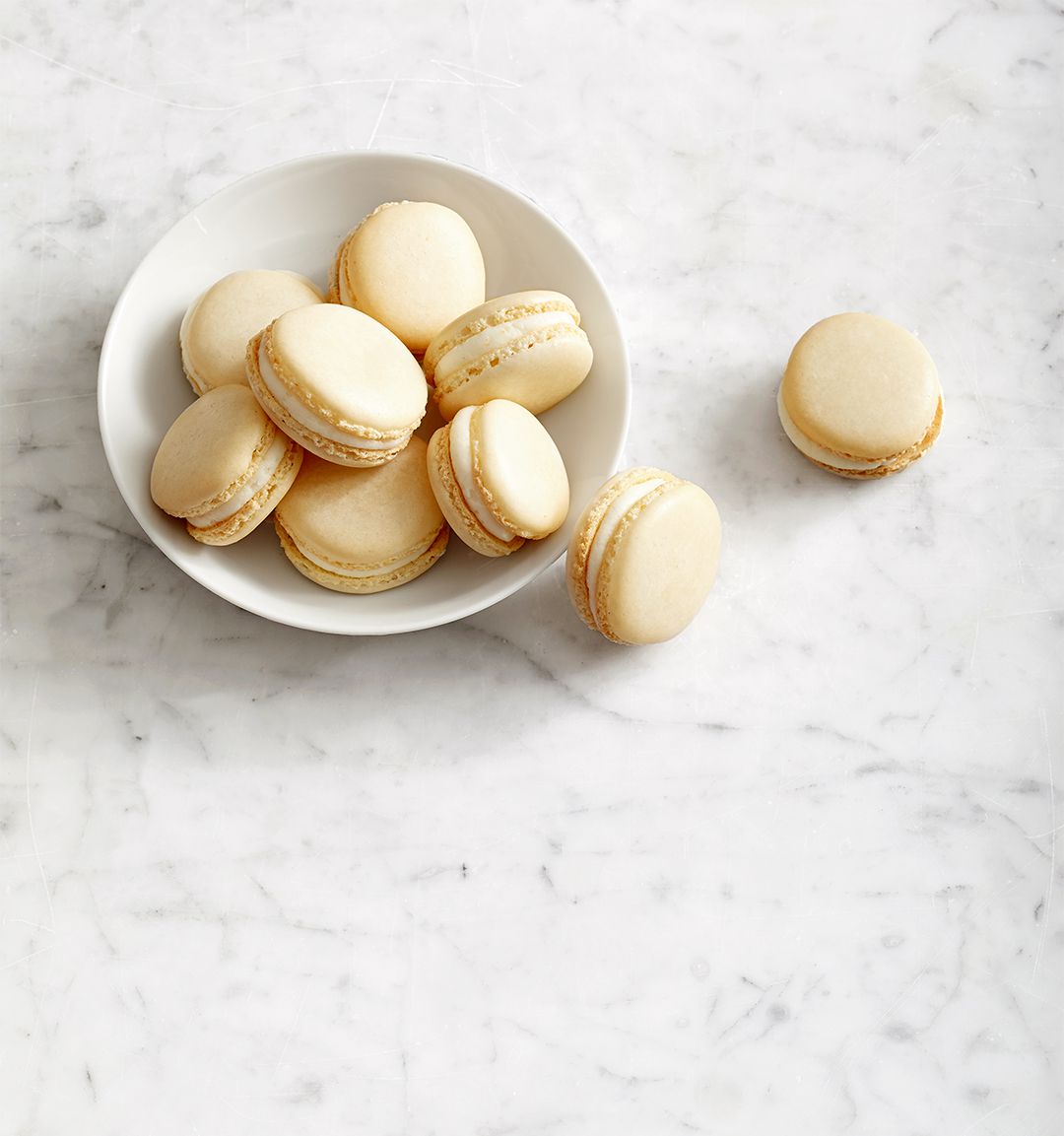 Double-Almond Macarons white bowl marble counter