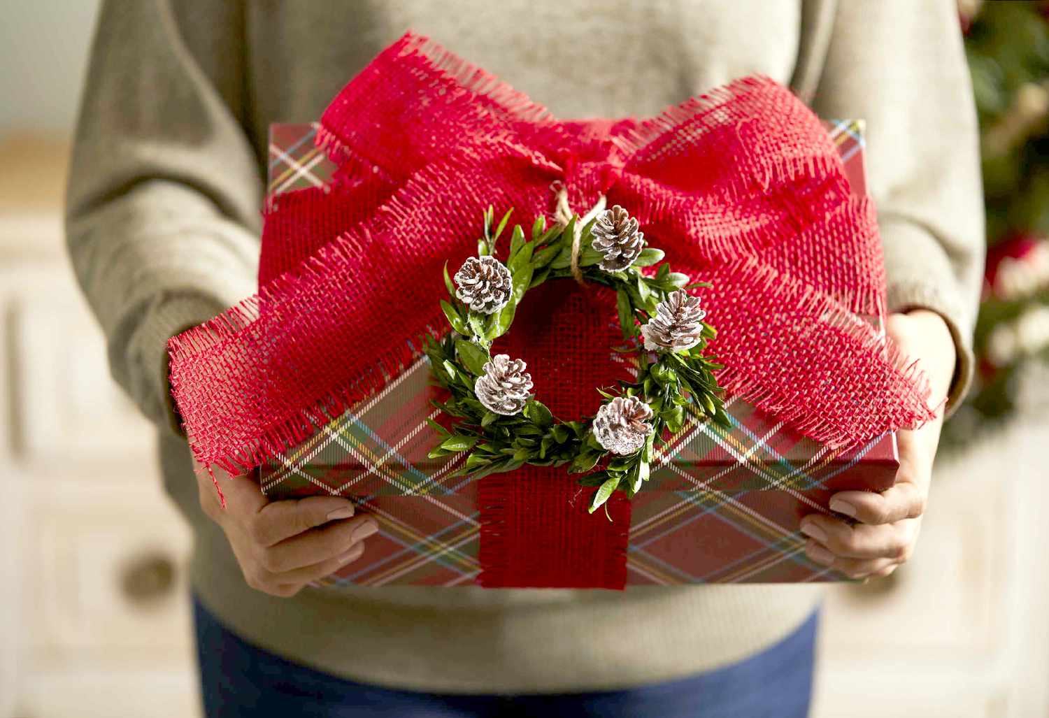 miniature boxwood wreath and red burlap on gift