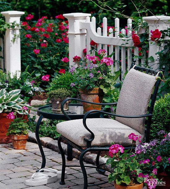Seating area by white picket fence