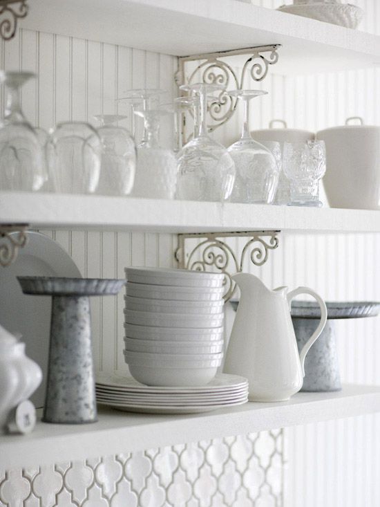 White shelves holding white dishes