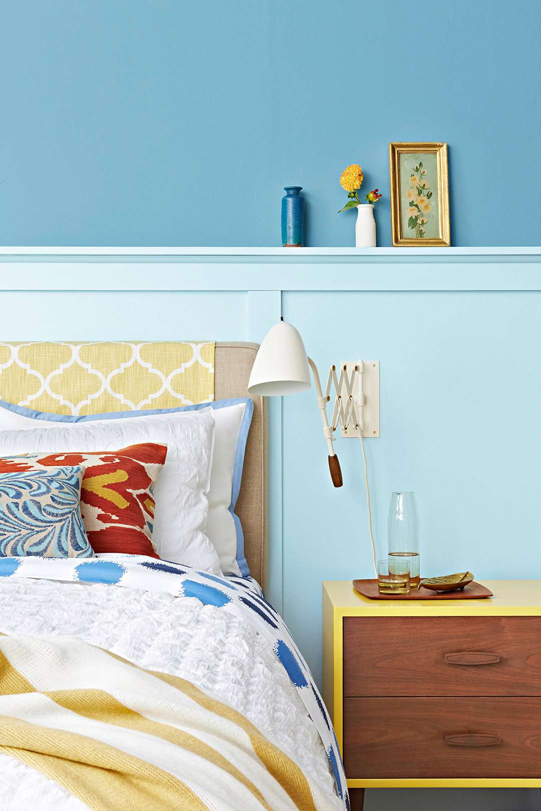 bedroom with blue walls and yellow accents