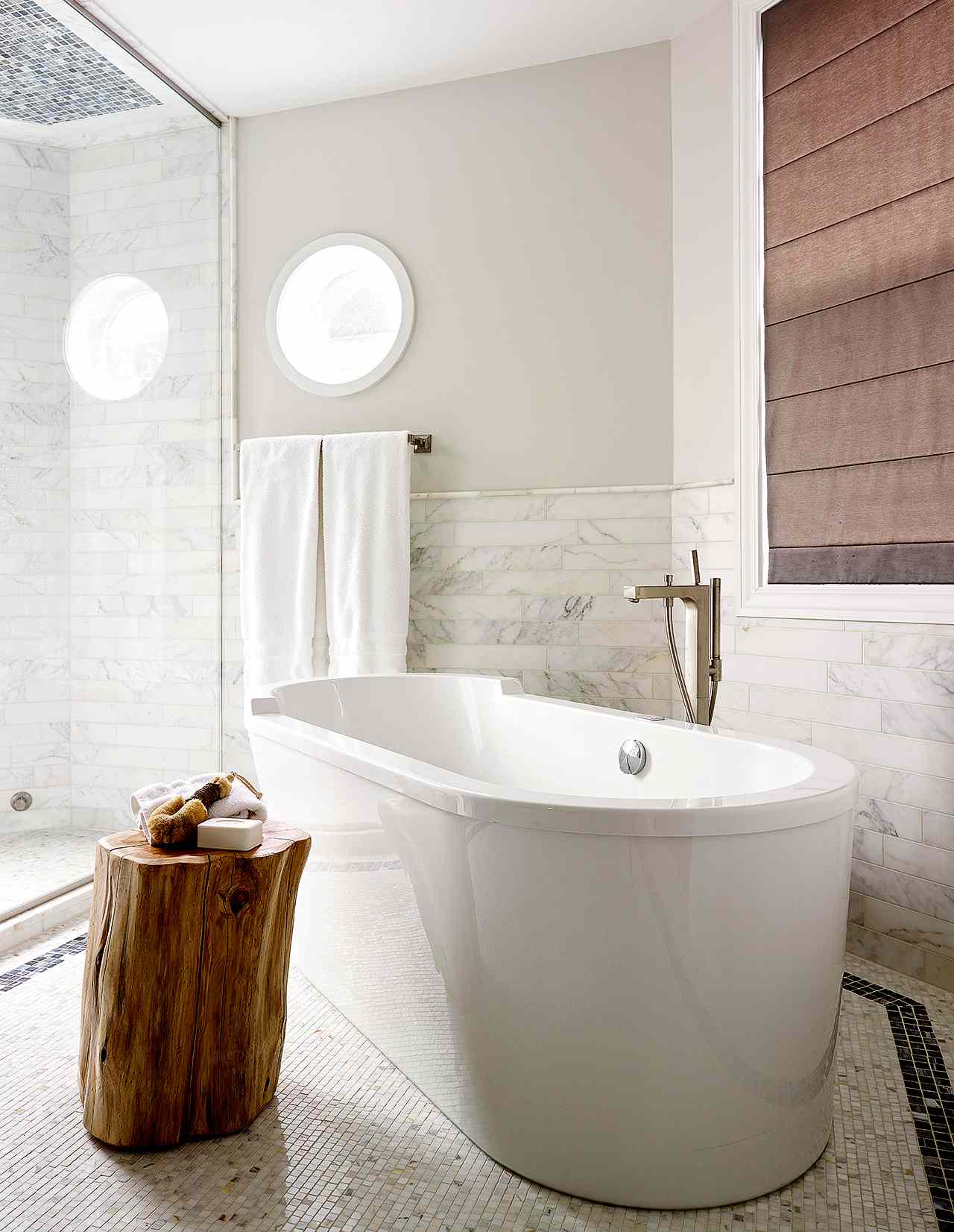 modern bath with freestanding tub and brown accents