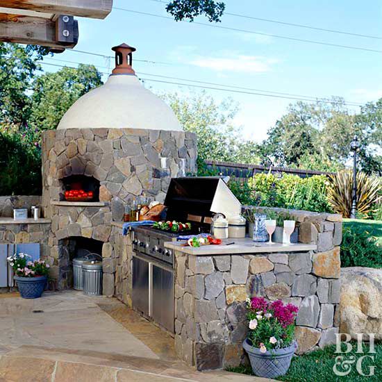 outdoor stone fireplace and dining area