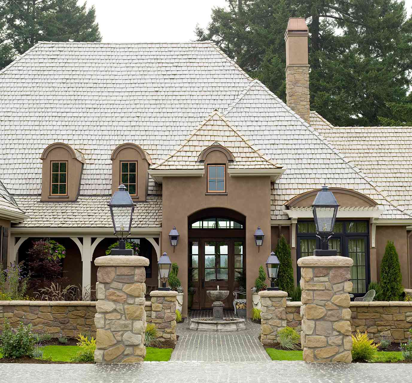 exterior of brown country french home entrance