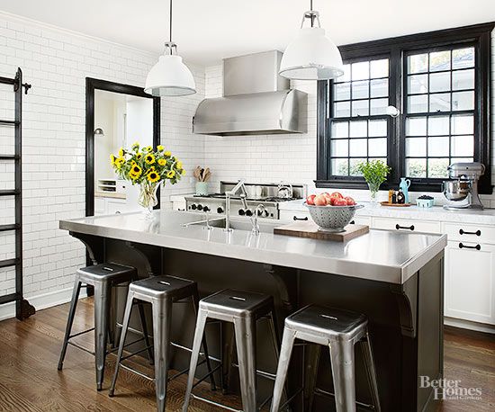 black and white kitchen with stainless-steel island