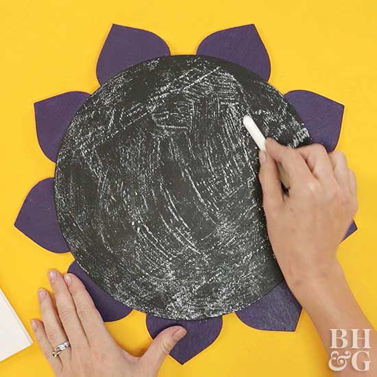 rubbing chalk onto paper sunflower