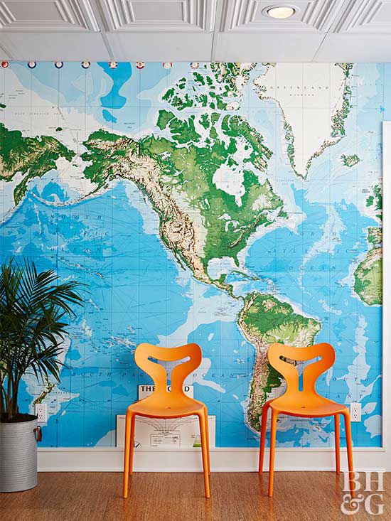 world map wallpaper and orange chairs