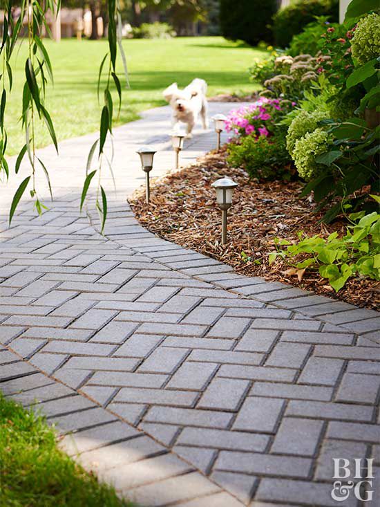 stone paver walkway with herringbone pattern