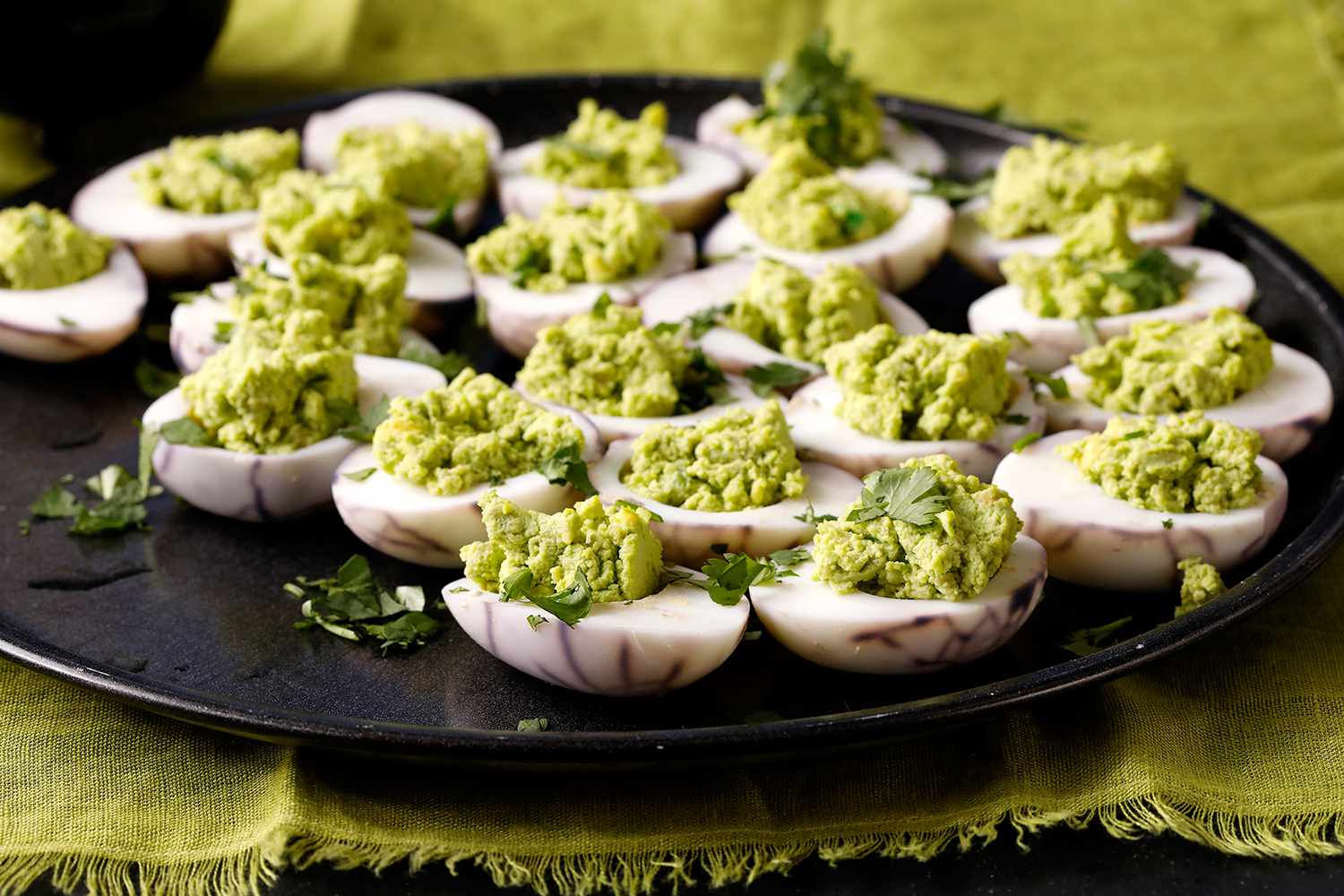 spider halloween deviled eggs with green filling recipe