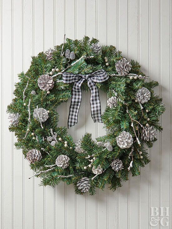 Silver pinecone accented wreath with plaid bow