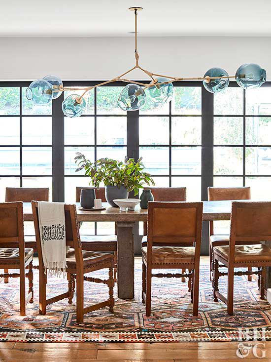 dining room with blue glass-shade chandelier