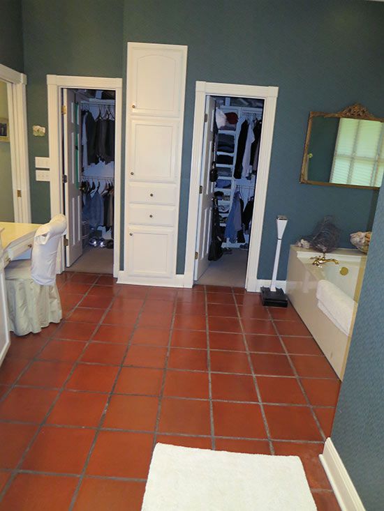 bathroom with walk-in closets