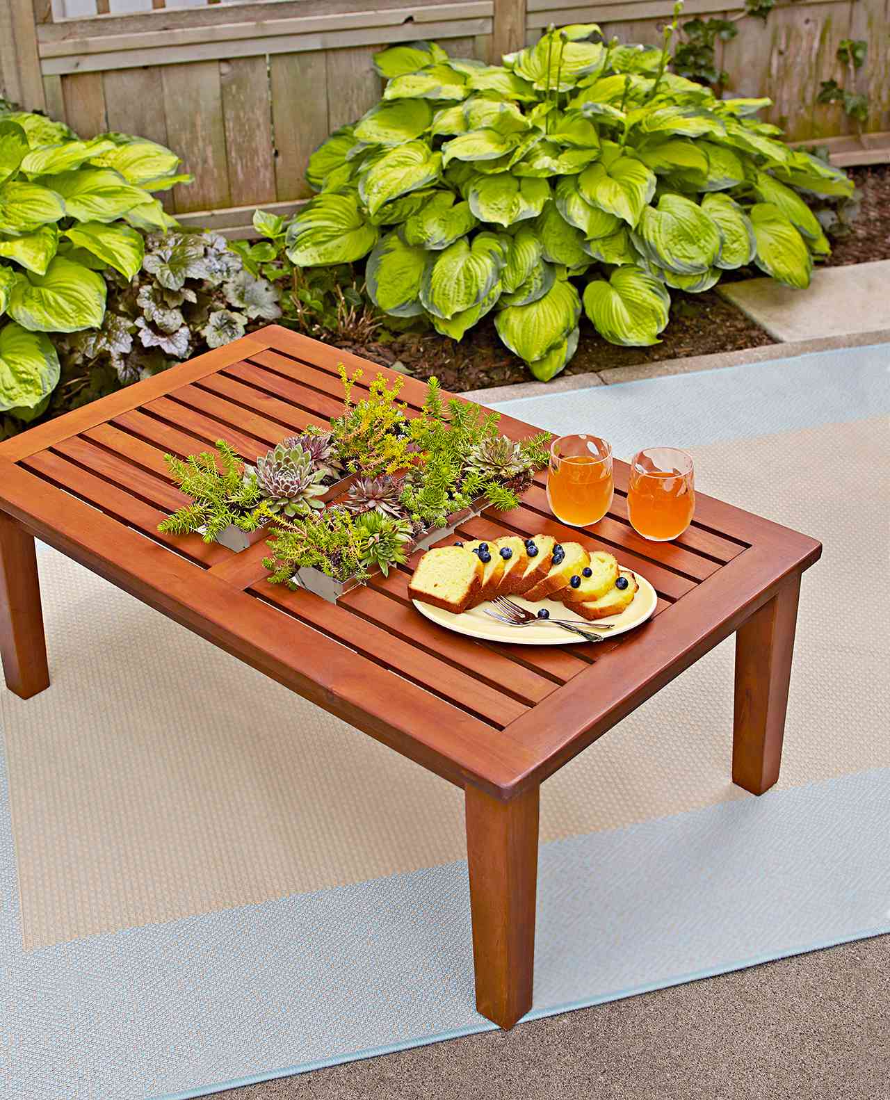 table with inset succulent planters