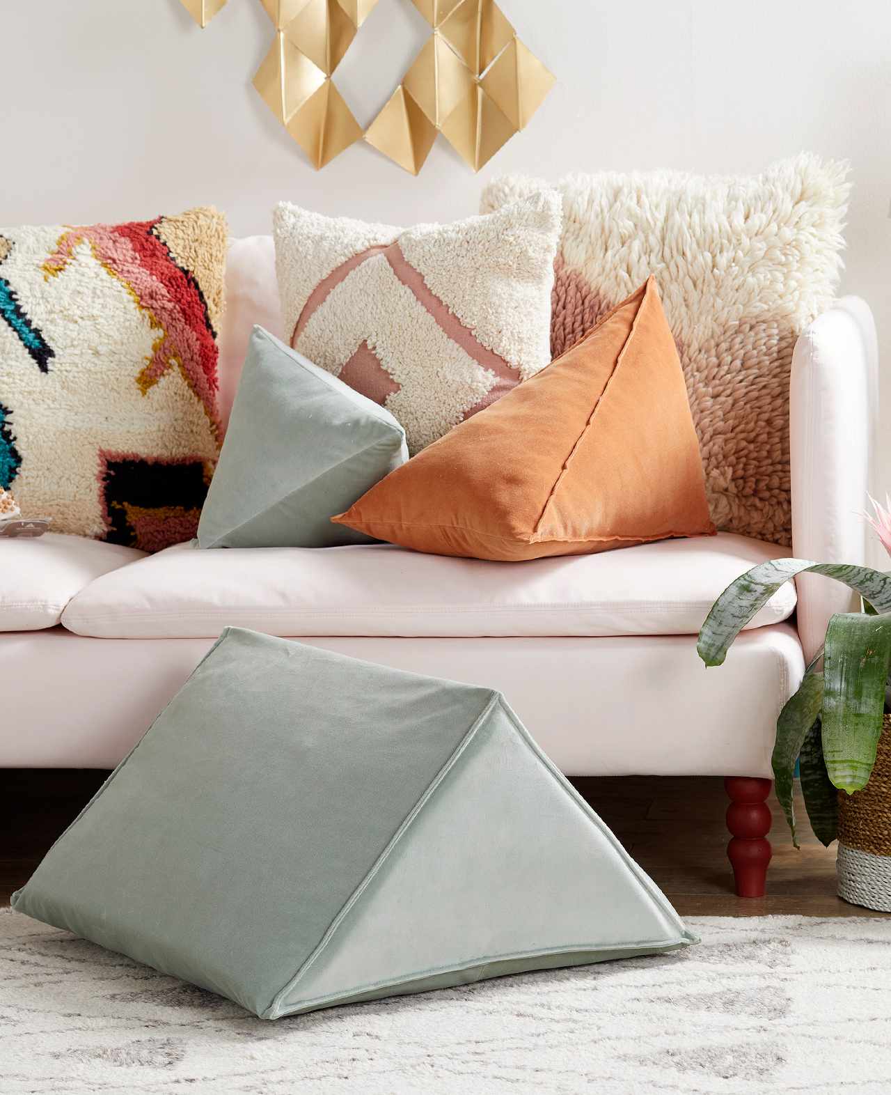 sofa with wedge pillows and soft colors