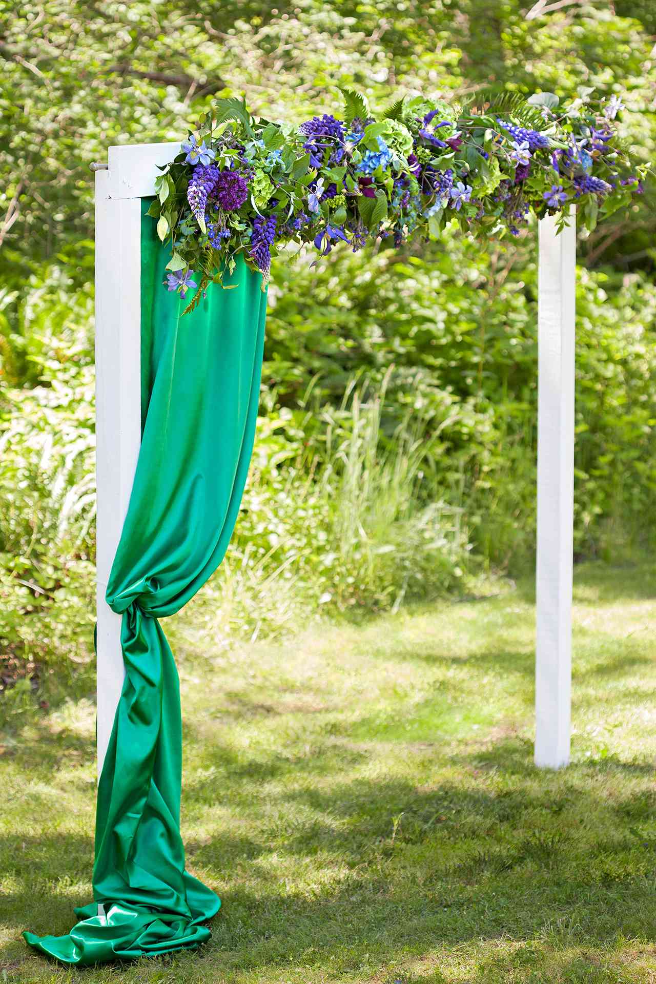 purple floral arch with green fabric project