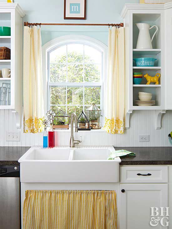 farmhouse sink with yellow curtains