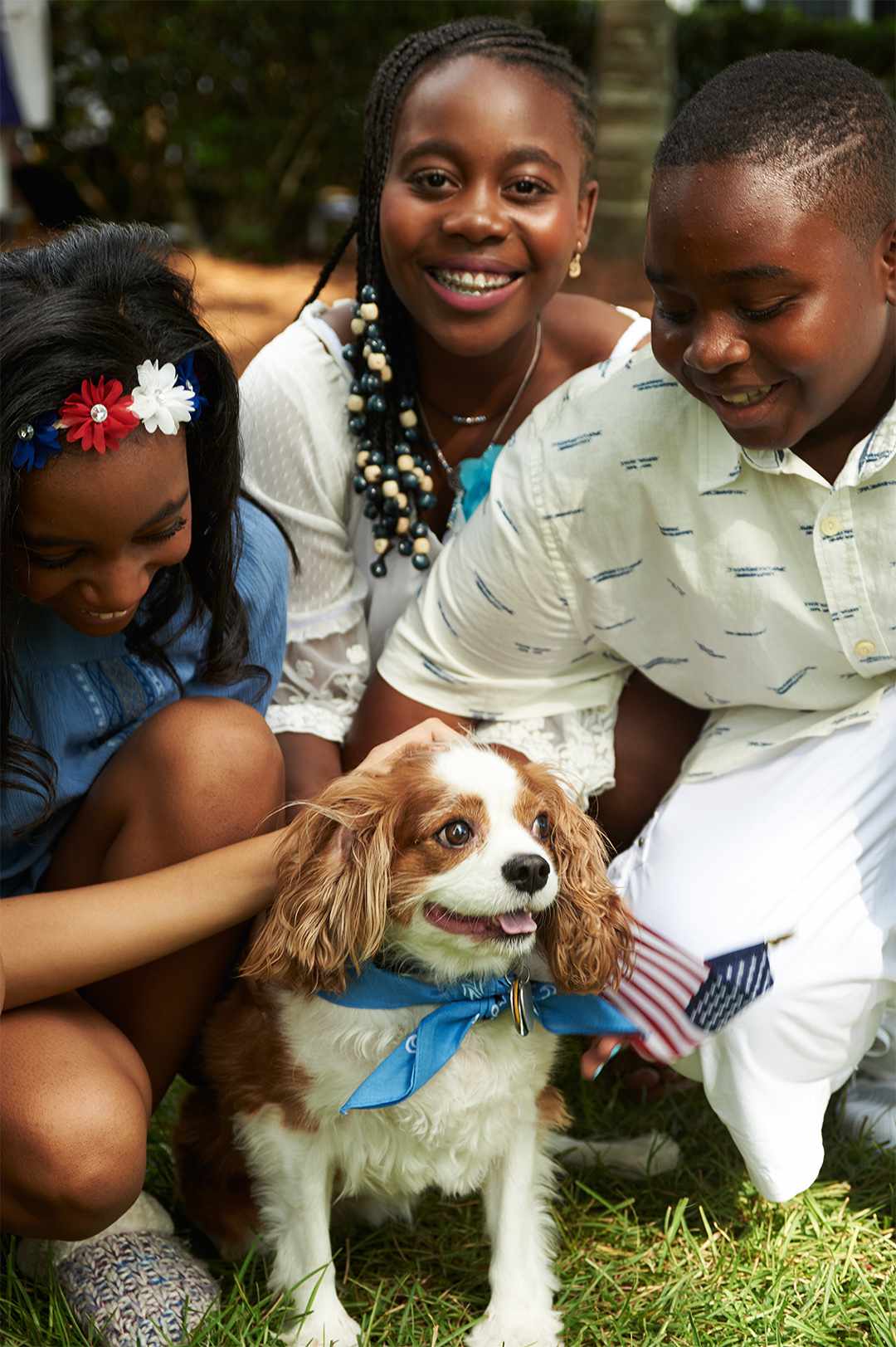 fourth of july burger party kids petting puppy