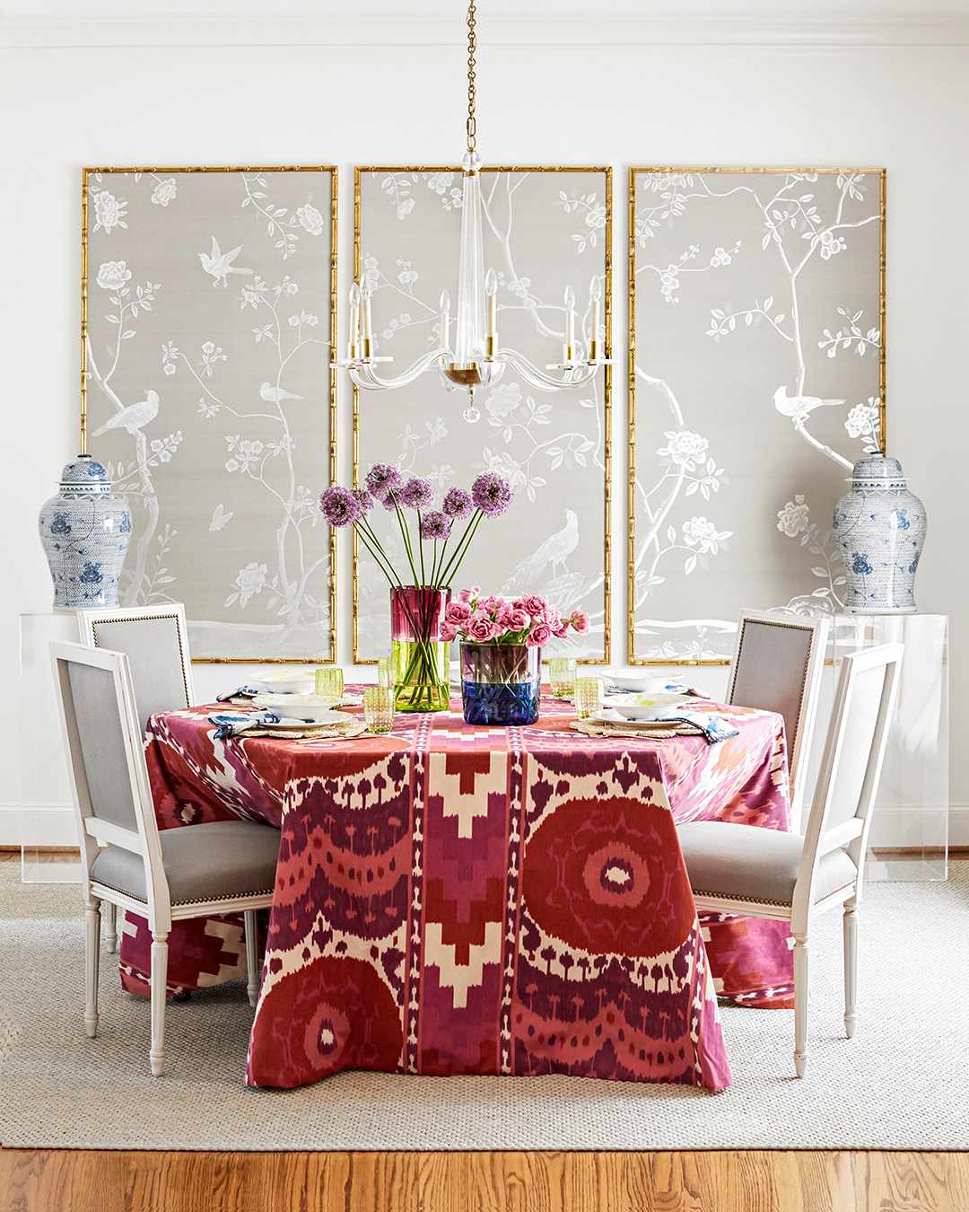 neutral dining room with pink ikat tablecloth and grey chairs