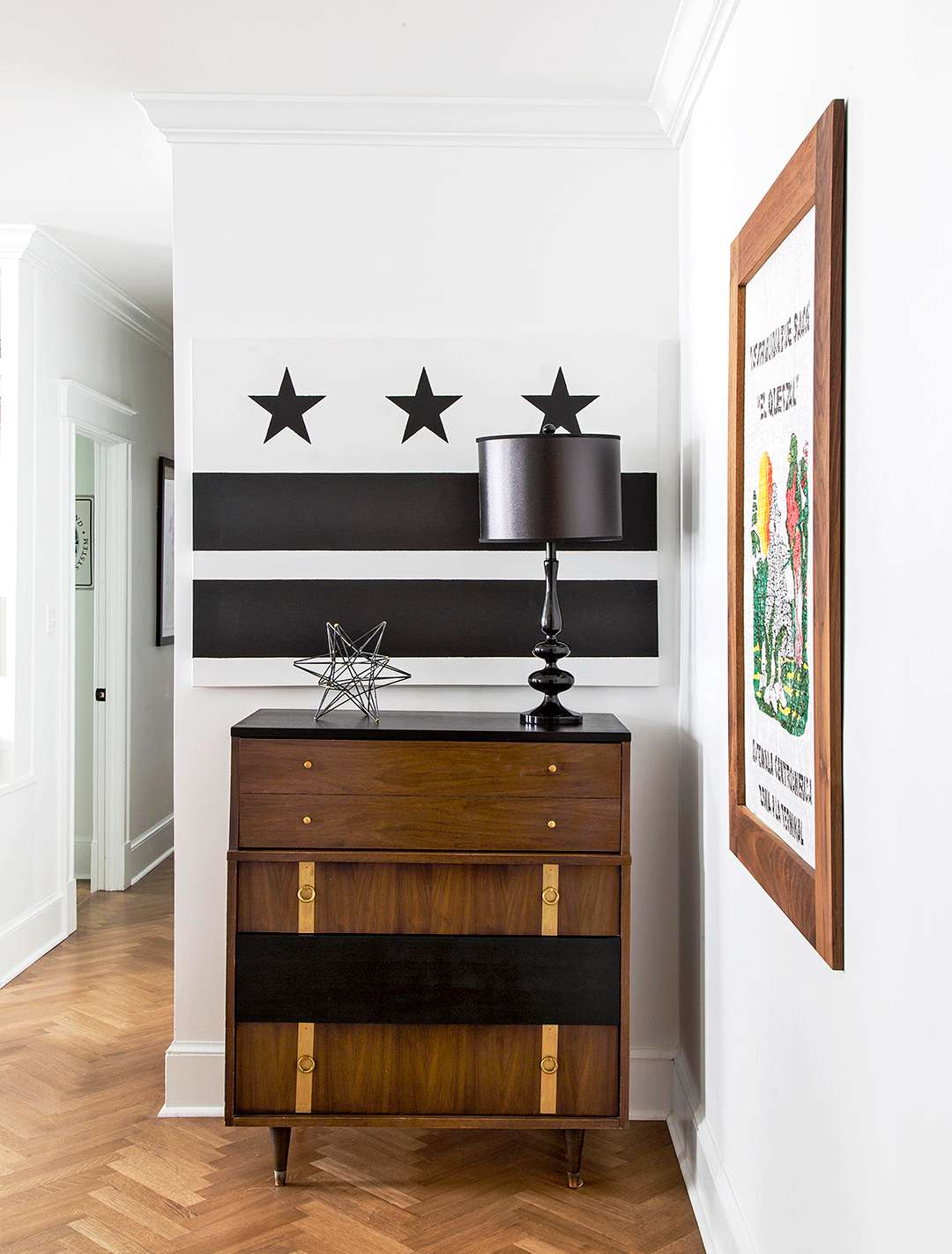 black and white decor above midcentury furniture