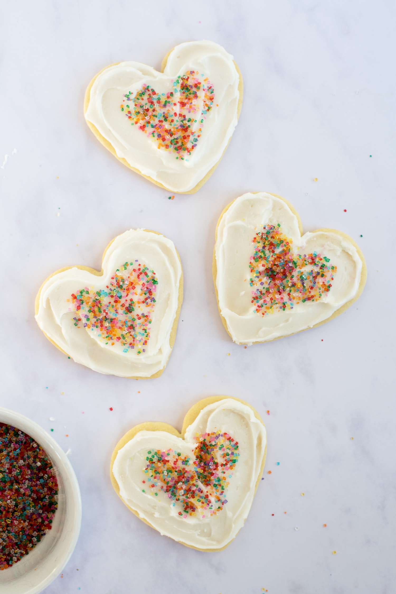 finished heart-shaped cookies with rainbow sprinkles