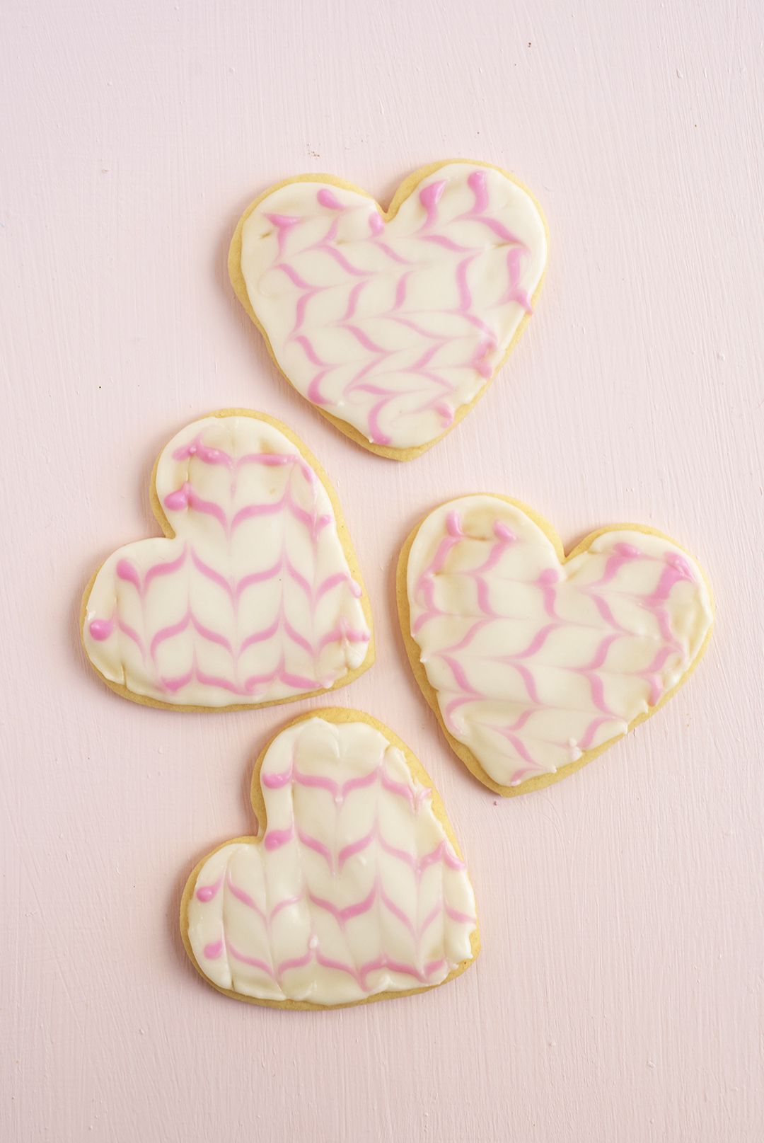 marble-effect icing on heart-shaped cookies