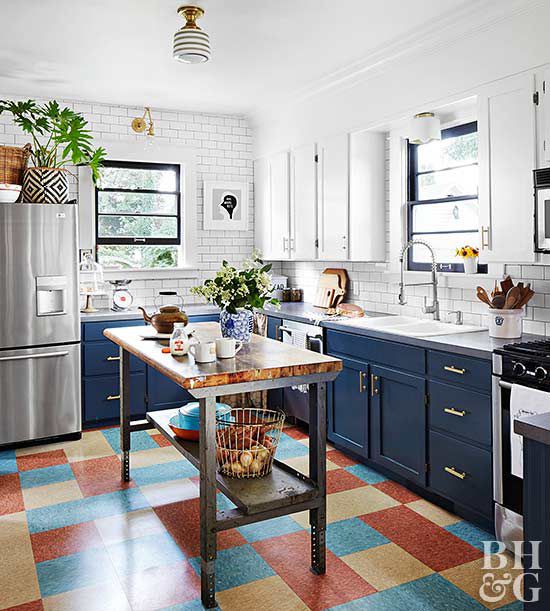 blue and white cabinet kitchen with white subway tile backsplash