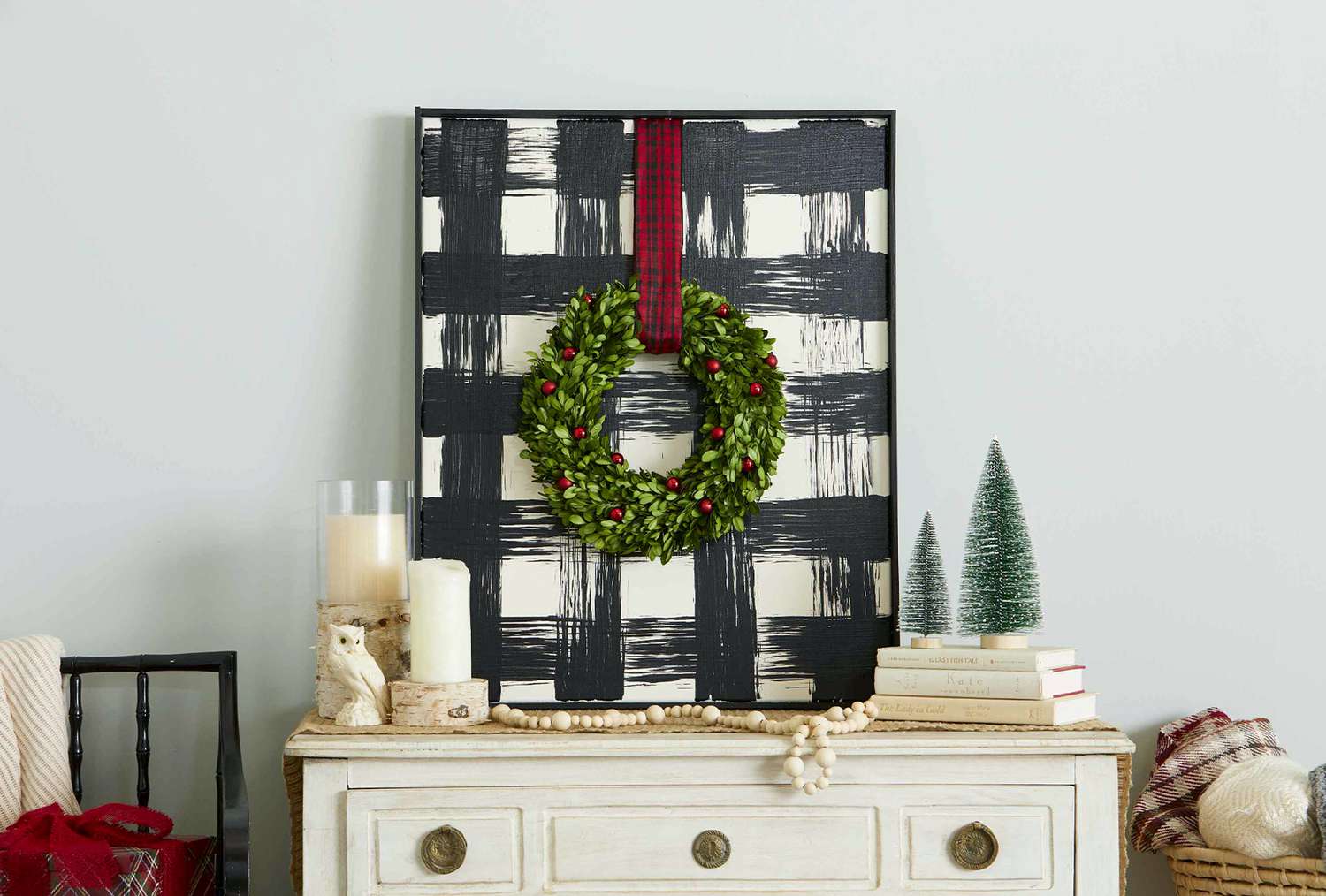 buffalo check canvas art with hanging wreath sideboard