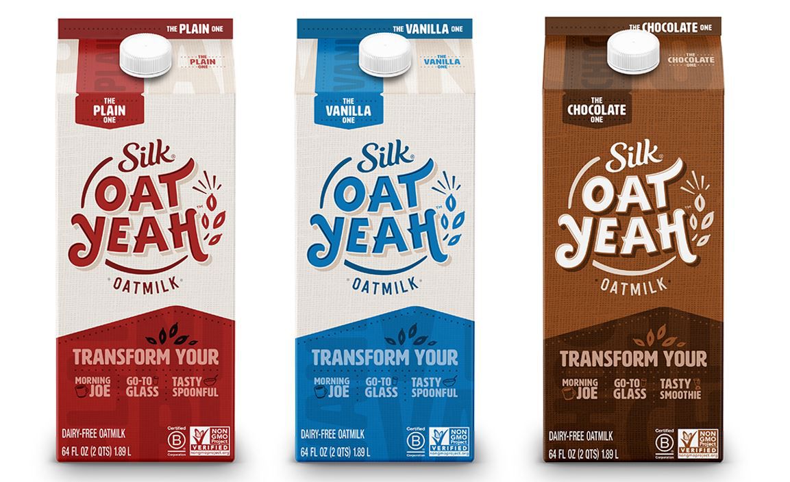 Plain, vanilla, and chocolate cartons of Silk oat milk