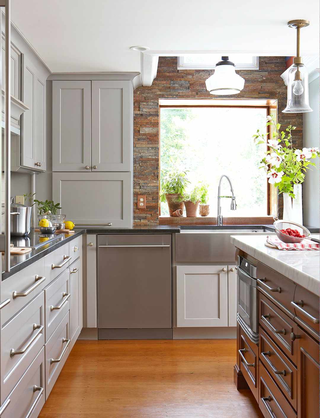 neutral tones kitchen with large window and wood floors