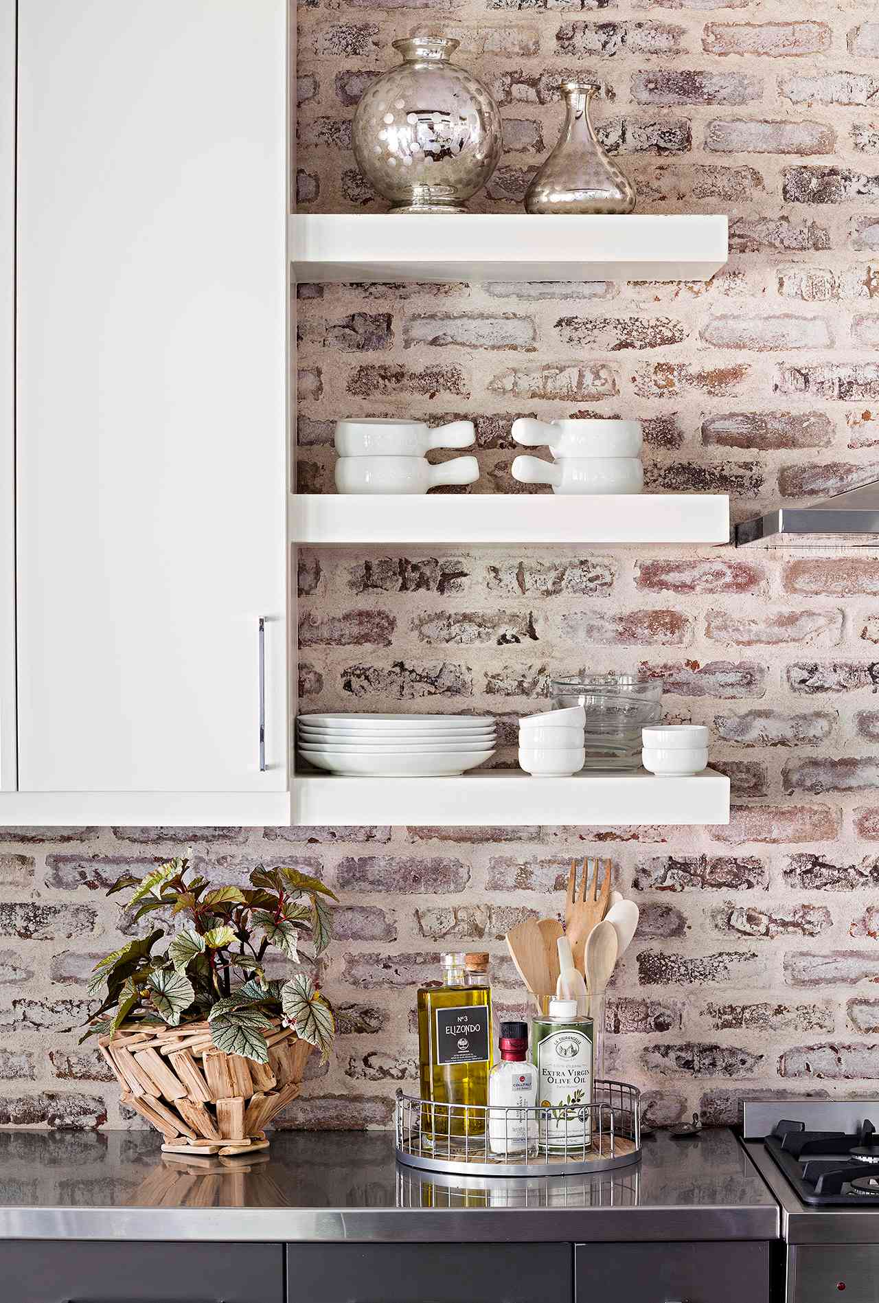 minimalist open shelving and brick backsplash