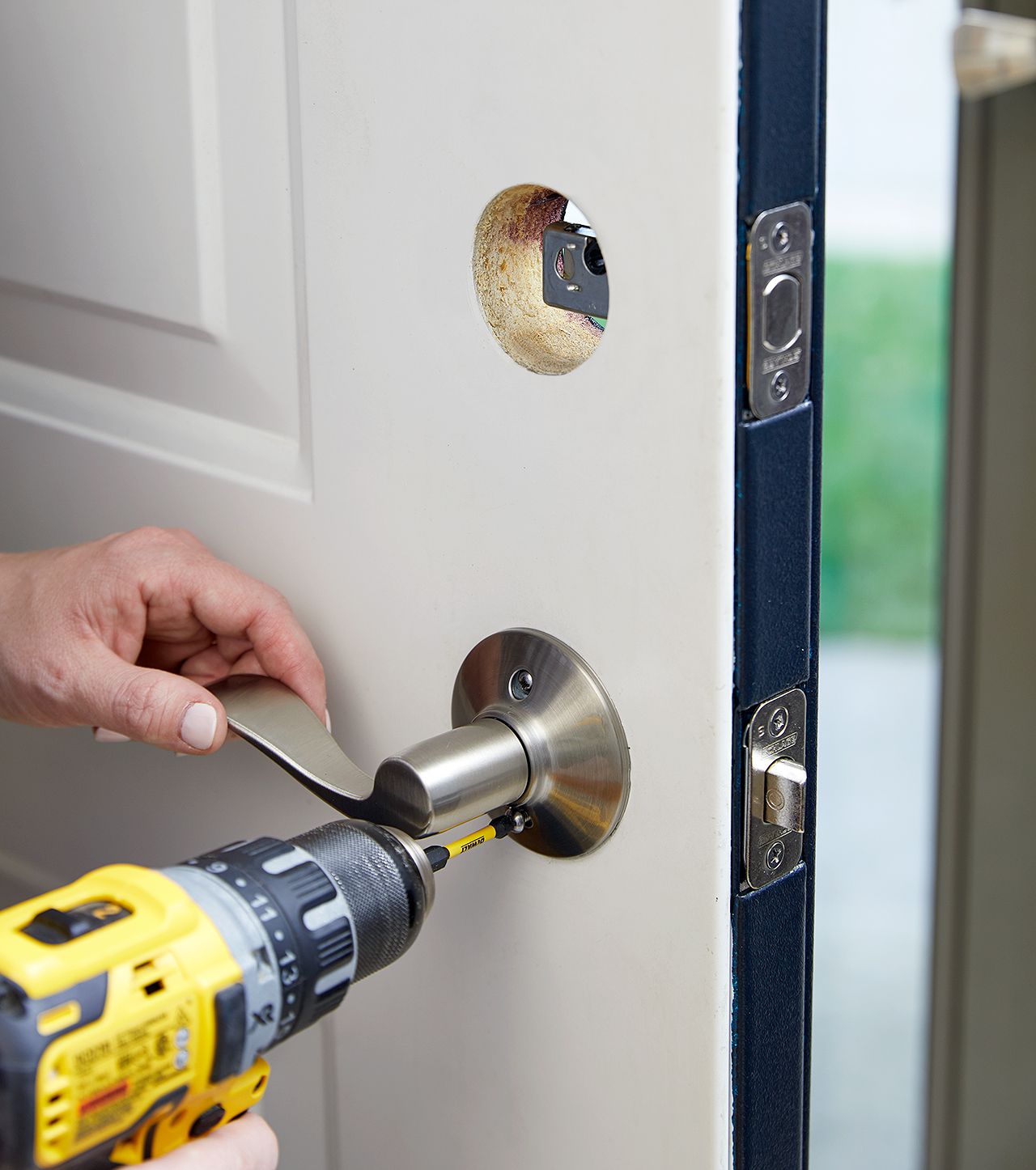 add screw to interior door handle to secure