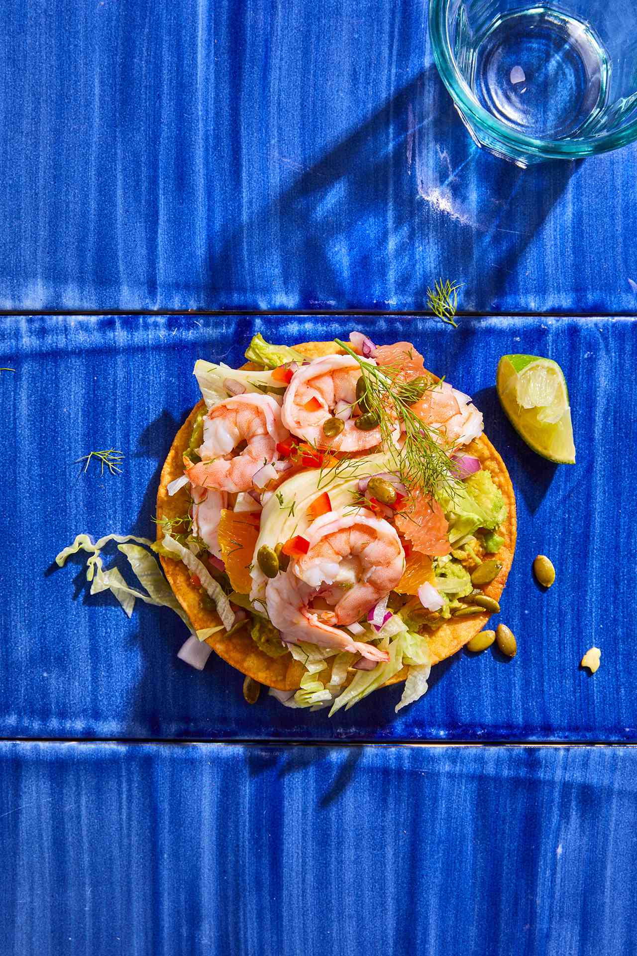 Shrimp Ceviche Tostada with Fennel and Grapefruit on blue counter